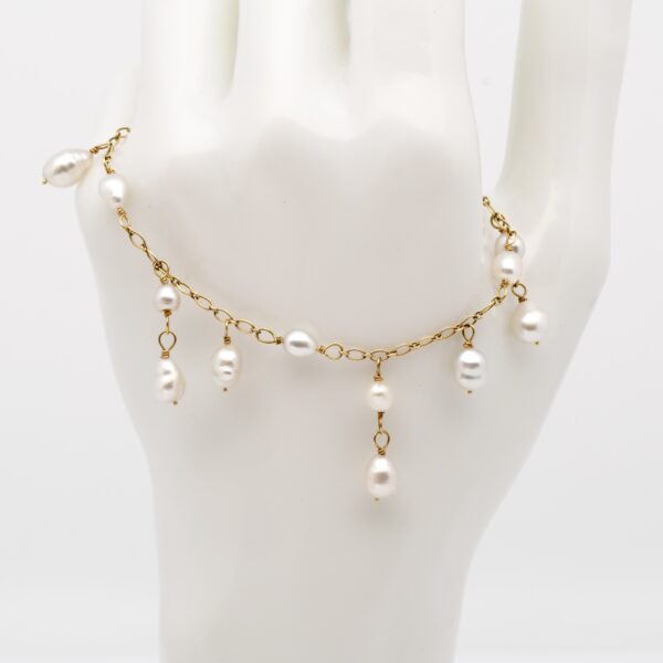 Bracelet Poeiti avec 19 keshi de Tahiti blancs nacrés montés sur chaîne en or jaune 14K